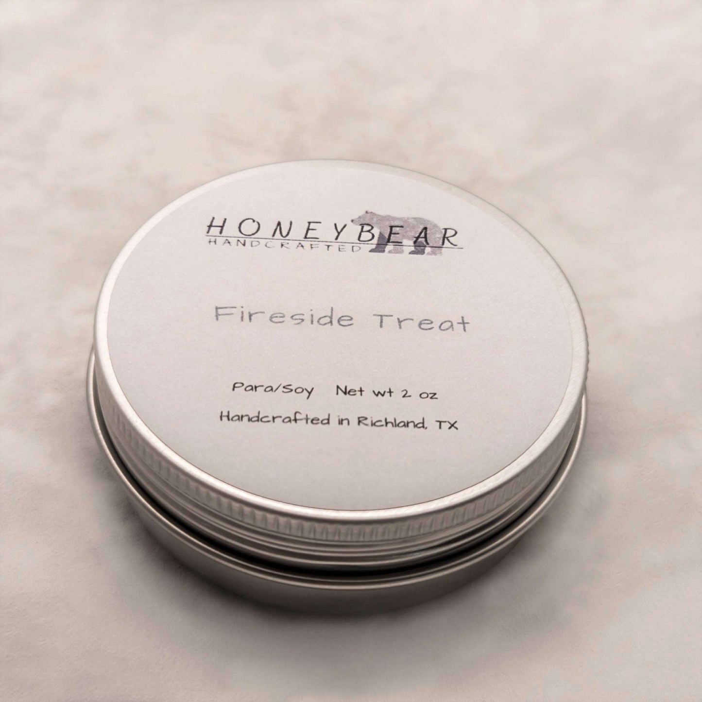 image of 2 oz travel or sample size candle labeled Fireside Treat on a white background