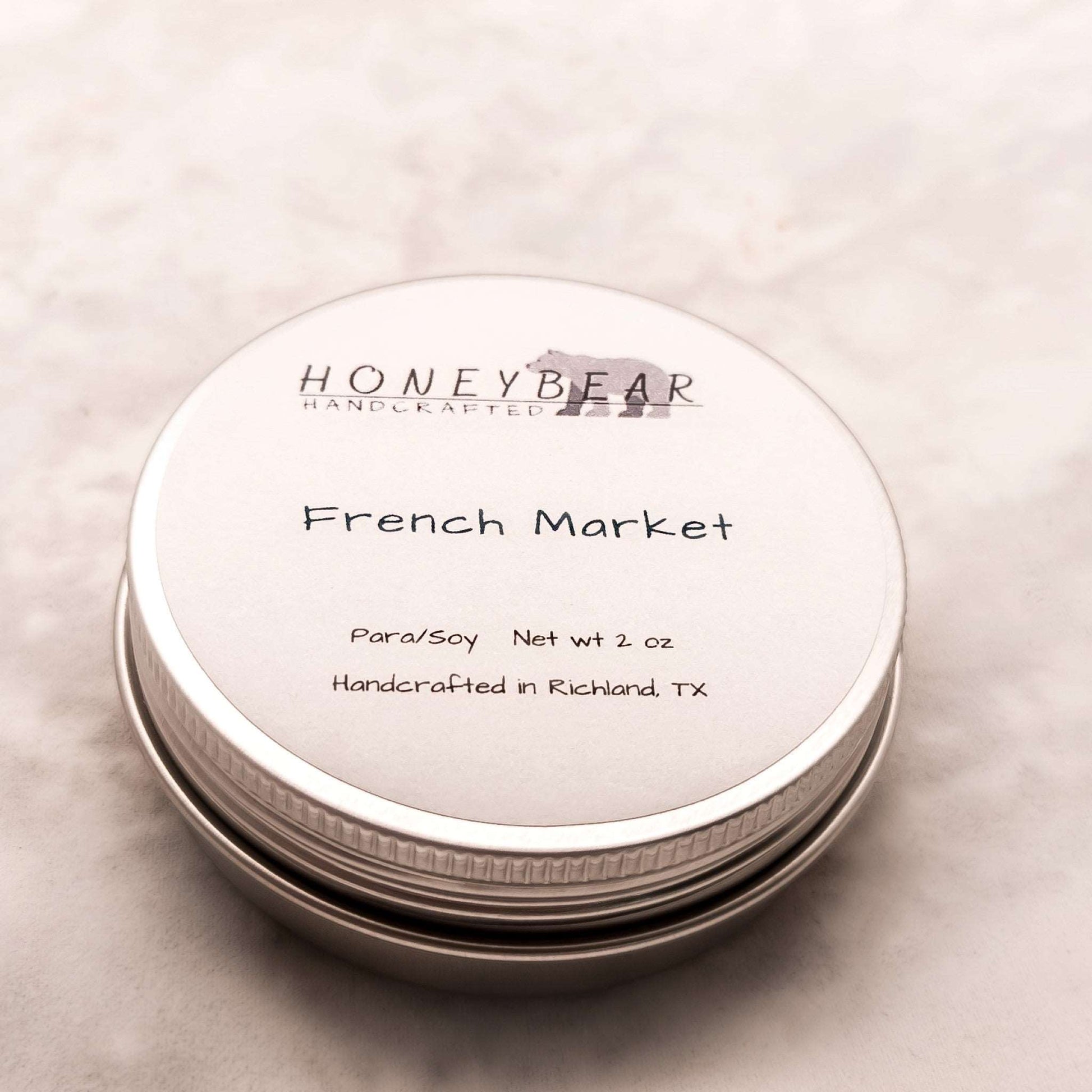 image of 2 oz travel or sample size candle labeled French Market on a white background