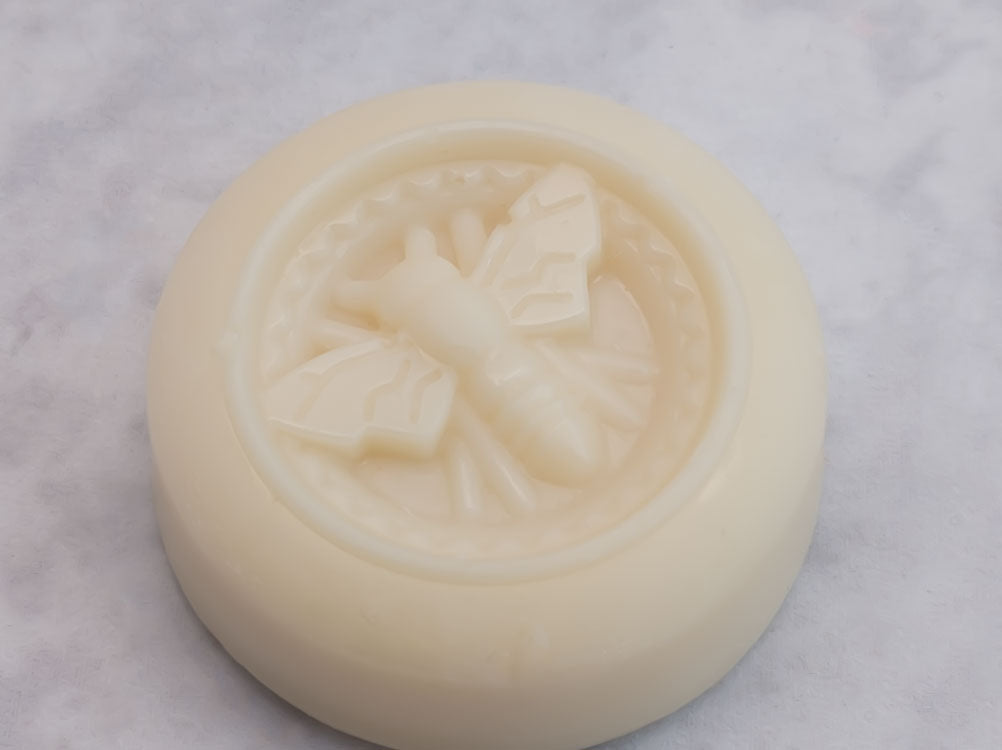 Shimmering Strawberry lotion bar on white background. Luxurious skin nourishing lotion bar. Romantic scent.